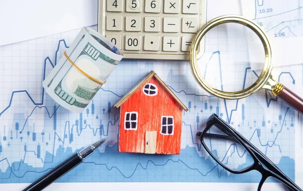 House Model Money Magnifying Glass Eyeglasses Pen Calculator Financial Graphs — Stock Photo, Image