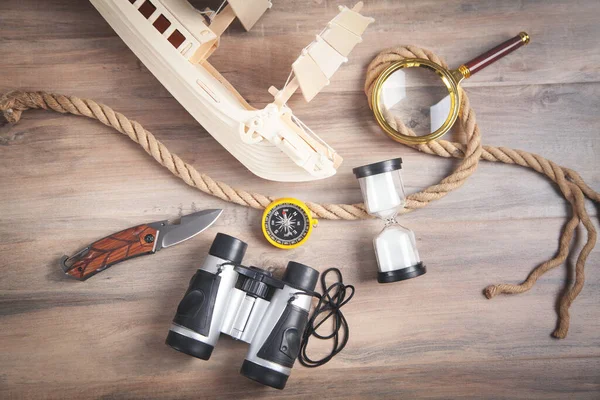 Wooden Toy Ship Compass Rope Binoculars Magnifying Glass Hourglass Knife — Stock Photo, Image