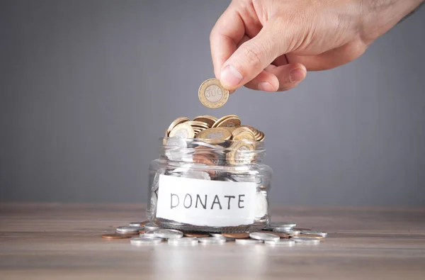 Male Hand Putting Coin Donation Jar — Stock Photo, Image