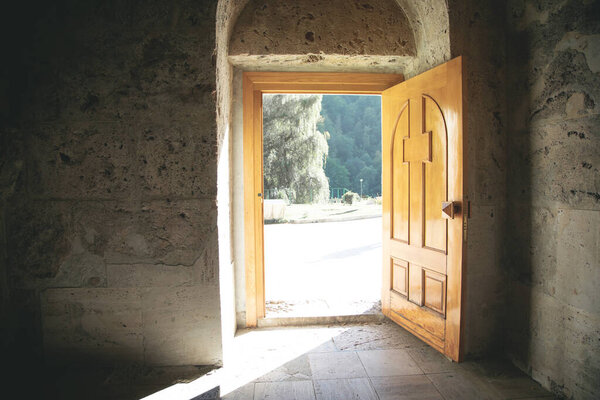 View of opened church wooden door.