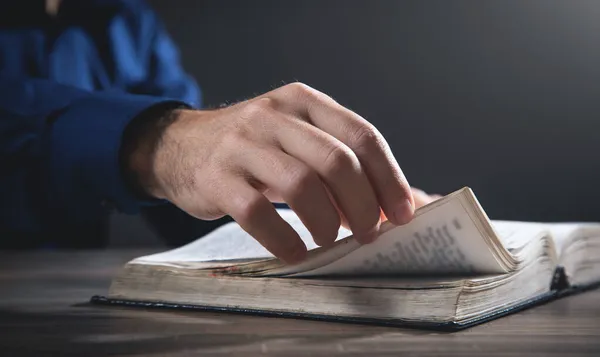 stock image Caucasian man reading the Holy Bible.