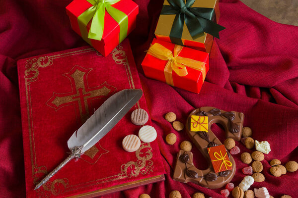 The book of Sinterklaas, presents a chocolate letter and candy called pepernoten. Concept for the cozy evening giving presents for Sinterklaas called pakjesavond