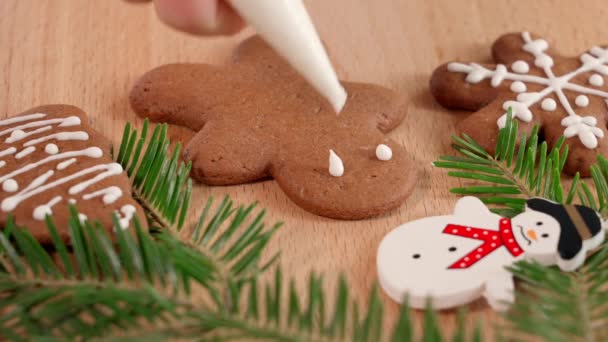 Drawing White Icing Christmas Cookies Table Decorated New Year Holiday — Stock Video