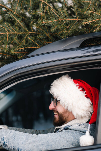 Man Wearing Santa Claus Hat Car Christmas Tree Roof New Stock Photo