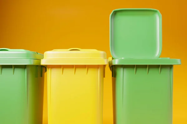 Green and yellow garbage bins with open lid on orange background, 3d render illustration. Sorting trash or litter, recycling concept, clean and neat copy space background, vivid colors