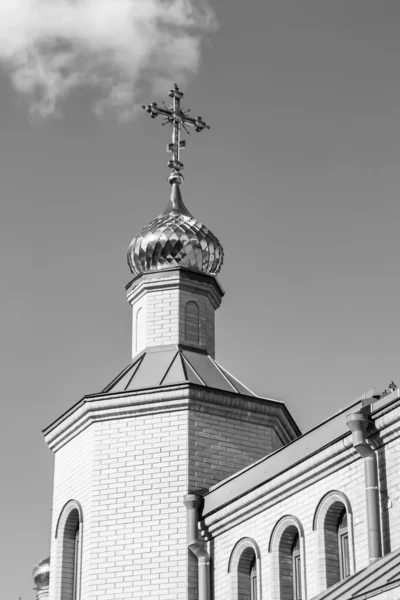 Christian church cross in high steeple tower for prayer, photography consisting of beautiful church with cross on steeple tower to sincere prayer, cross steeple tower is church prayer over clear sky