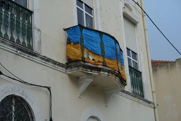 Ukrainian flag on building balcony