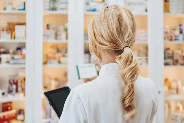 Young Attractive Female Pharmacist Working Drugstore She Confident Serious View — Zdjęcie stockowe