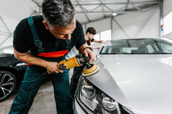 Professional Car Service Worker Polishing Luxury Car Orbital Polisher Car Stock Picture
