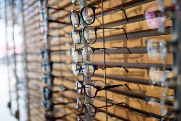 Different Eyeglasses Frames Wall Modern Optical Store Retail Store Background — Stok fotoğraf