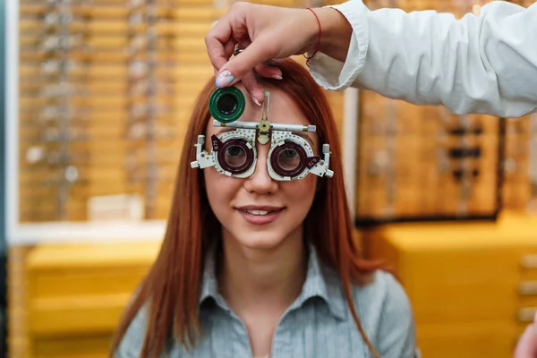 Positive Young Redhead Female Patient Checking Vision Modern Ophthalmology Clinic — стоковое фото