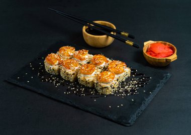 Shrimp sushi with sesame on black plate. Japanese sushi