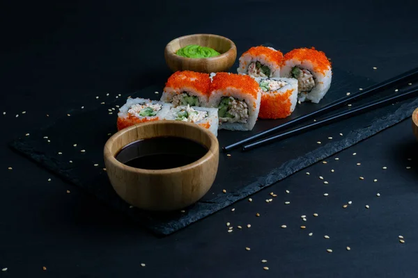 California Maki Sushi with Masago - Roll made of Crab Meat, Avocado, Cucumber inside