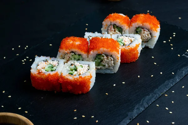 California Maki Sushi with Masago - Roll made of Crab Meat, Avocado, Cucumber inside