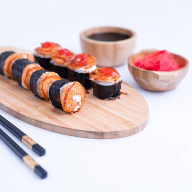 shrimp nigiri and sauce sushi on white background. Close Up of delicious japanese food with sushi roll.