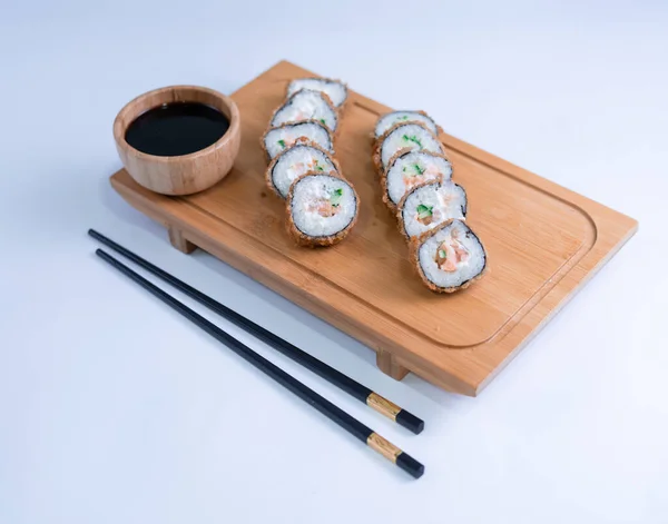 Baked sushi rolls. Hot fried Sushi Roll with salmon, avocado and cheese. Sushi menu.