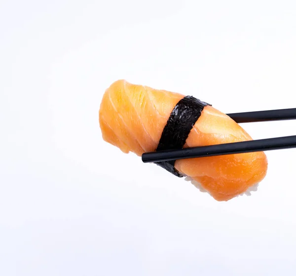 Fresh Traditional Japanese Sushi Salmon Sushi Chopsticks White Background — Zdjęcie stockowe