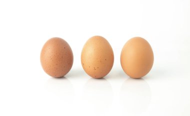 Fresh eggs are isolated on white background. Chicken eggs are rich in protein, vitamins, and essential minerals that are beneficial to the body.