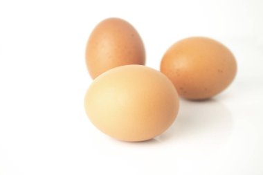 Fresh eggs are isolated on white background. Chicken eggs are rich in protein, vitamins, and essential minerals that are beneficial to the body.