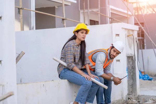 Engineer and architect are stressed at construction site,He is having problems in work,Engineering concept.