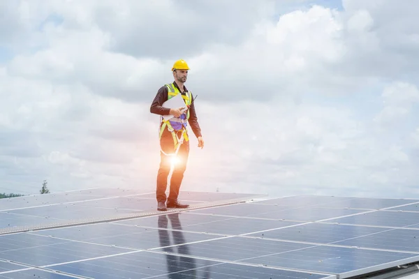 Technician checks and maintenance of the solar panel at solar power plant,Solar panels.