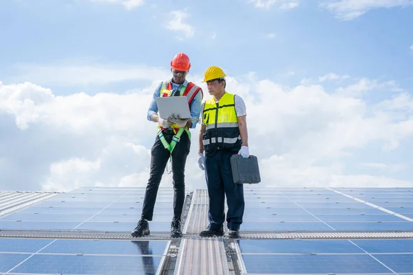 Electrical and instrument technician installation and maintenance electric system solar panel on the roof of factory,Service check installation solar cell.