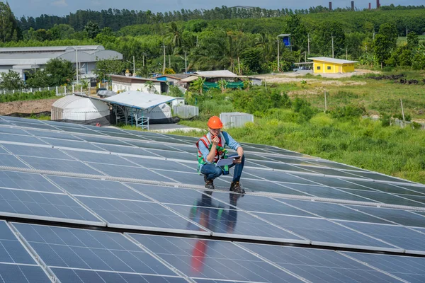 Technician inspection and repair solar cell on the roof of factory,Service check installation solar cell.