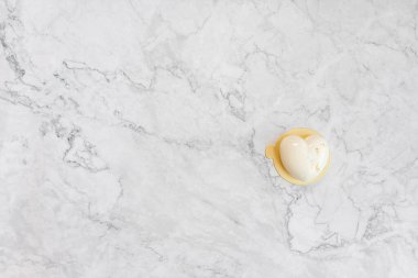 White cake on a light marble table. Background for cards for Valentine's Day