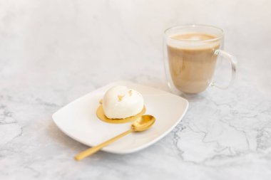 Coffee and white cake on a light marble background. Background for Valentine's Day