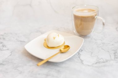 Coffee and white cake on a light marble background. Background for Valentine's Day