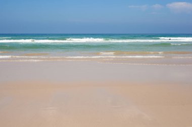 Surfers on the Malhao beach - Atlantic ocean - Portugal