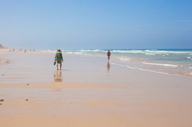 Hiker on the Malhao beach - Fishermans trail - Atlantic ocean - Portugal