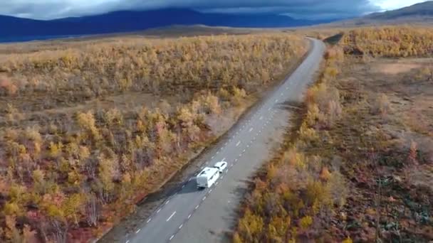 50fps drone footgage Car Camping Caravan driving road lake Swedish Lapland Sunny fall colors Abisko National Park Sweden — Stock Video