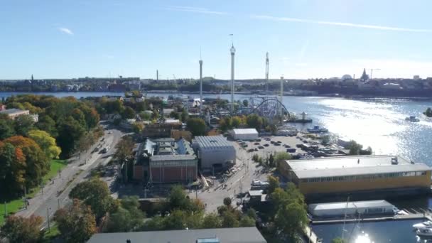 Panorama of Stockholm city on a sunny day - Grona Lund amusement park, Djurgarden and Stockholms inlopp — стокове відео
