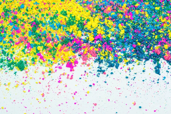 Colorful powder splashed on a white background