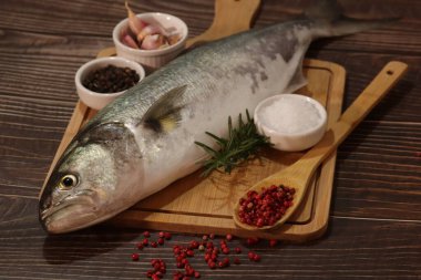 Baked fish with vegetables, anchovy