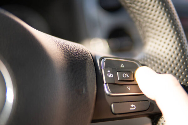 Detail of a man driving his car
