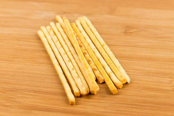 Yellow Corn Snack Sticks Side View Wood Cutting Board — Stock Photo, Image