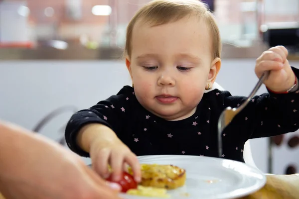 Little Beautiful Baby Girl Black Dress Eats Food Plate Forks Royalty Free Stock Photos