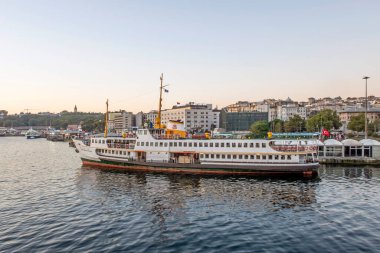 istanbul,Turkey.July 27,2022. The symbol of sea transportation in Istanbul. City lines ferry. The ferry at Eminonu pier early in the morning.