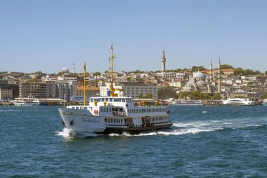 Bosporus,istanbul,Turkey.July 29,2022.The magnificent view of the Bosphorus with the city lines ferry, the symbol of sea transportation in Istanbul, in summer.