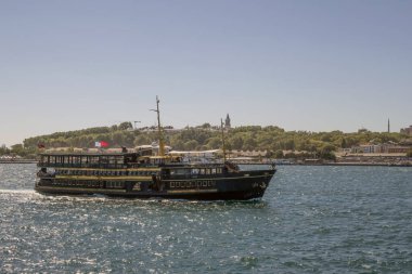 Bosporus,istanbul,Turkey.July 29,2022.The magnificent view of the Bosphorus with the city lines ferry, the symbol of sea transportation in Istanbul, in summer.
