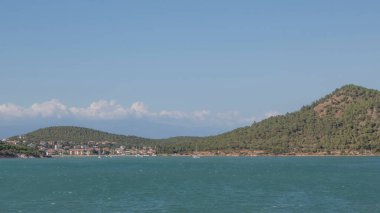 Ayvalik,Balikesir,Turkey.August 11,2022.Ivy Sailing Resort Hotel, located on the Seytan Sofrasi road of Ayvalik district, has a bird's eye view of Ayvalik Bay, Ayvalik Islands and Cunda Island. Holiday and summer view from the hotel.