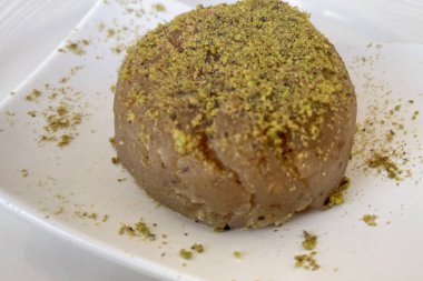 ready to eat traditional Turkish un halva dessert with pistachios
