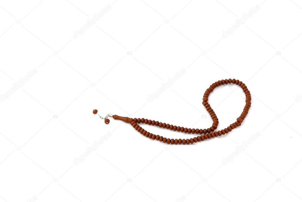 rosary standing on a white background, rosary in islam, close-up prayer rosary,