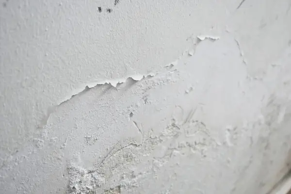 Paint swelling on the wall due to moisture, damp wall samples, damp wall and damage to the paint,