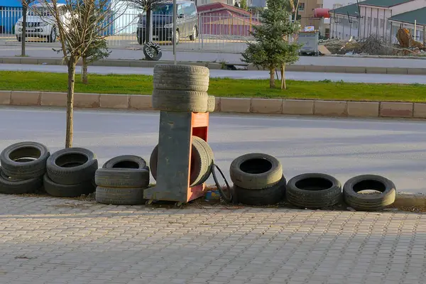 car tire repair shop, old tires are piled up in the tire shop,