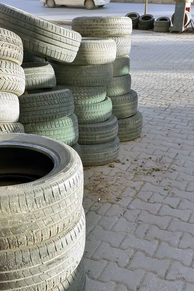 car tire repair shop, old tires are piled up in the tire shop,