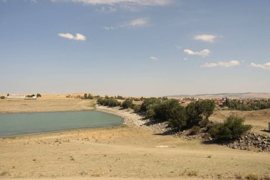 The irrigation dam of a village has lost a lot of water as a result of drought, the pond whose water has decreased, the tragic situation of the drought and irrigation pond,