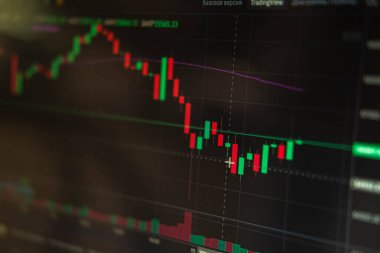 Financial chart, stock analysis data on digital screen. Cryptocurrency growth charts. Blur and selective focus